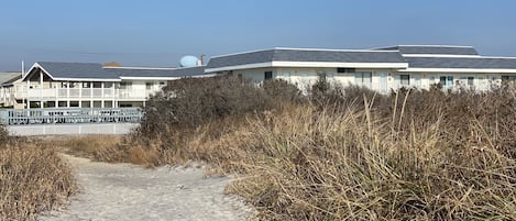 One of 2 path ways leading to the beach on either side of the complex