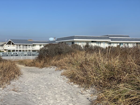 One of 2 path ways leading to the beach on either side of the complex