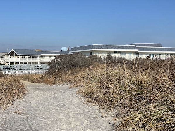 One of 2 path ways leading to the beach on either side of the complex