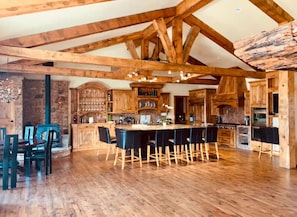 Custom Kitchen with built-in appliances and massive knotty pine beams and floors