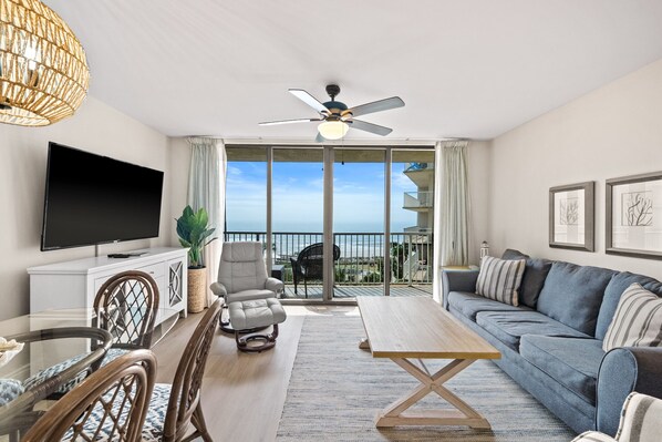 Open concept living and dining area with an amazing beach view!