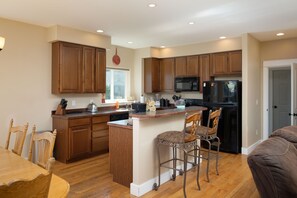 Kitchen, door to laundry and garage on right