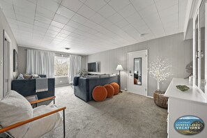 Cozy living room area with daybeds, fireplace and Smart. T.V.