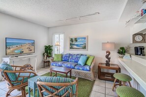 The main living area includes cable TV and plenty of seating to unwind after a day at the beach.
                