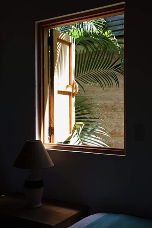 Lush nature through every window creating an enchanting vibe throghout