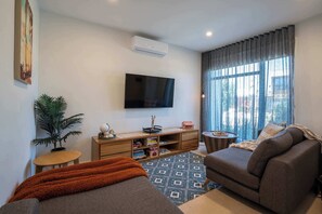 The interiors combine textured furnishings and neutral tones, creating a serene retreat