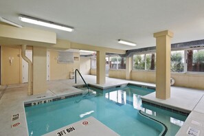 Small heated indoor pool in building