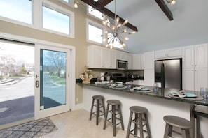 Additional counter seating in kitchen for up to four.