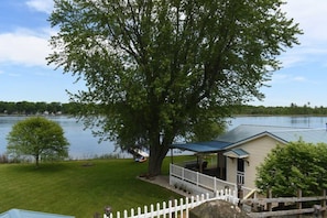 Large extra lot for playing yard games and campfire ring and several camp chairs.