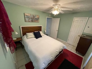 Queen Bedroom with AC unit, closet and dresser