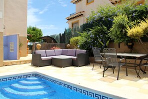 Seating at the pool to relax or dine