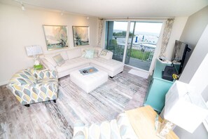 Beautiful living room overlooking the beach and pool