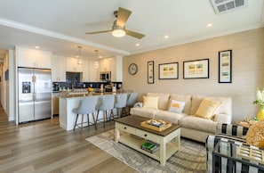 Living room (with a sofa bed), fully equipped kitchen and breakfast bar