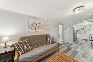 The downstairs living room has a full-sized futon with linens provided. 