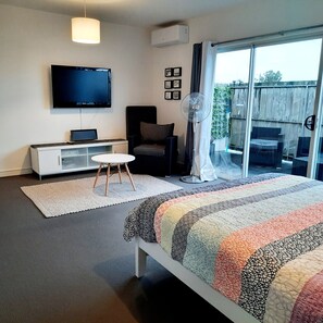 Master bedroom with smart tv, dvd player, sony radio speaker, airconditioner.