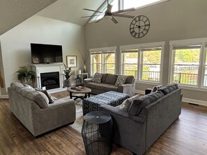 Large open living room with plenty of light and views of the lake