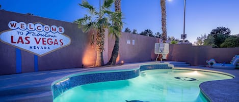 Night time view of pool area.