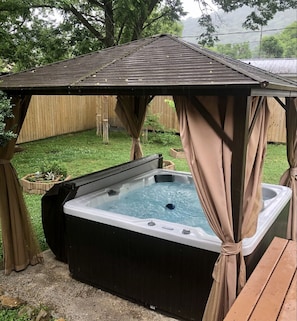 Hot Tub oasis. There is also a firepit & cornhole for great outdoor activities