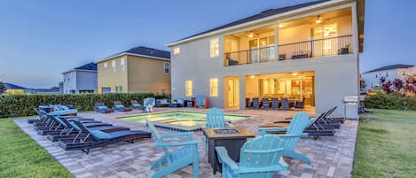 The outdoor oasis has a grill, fire pit, daybed, pool basketball hoop and more!