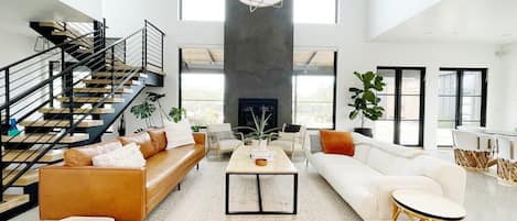 living space with floor to ceiling windows and fireplace