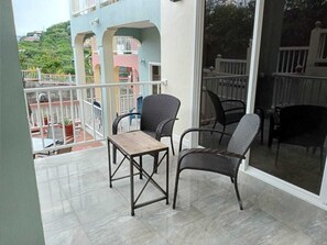 Cool and relaxing patio outside living room and leading to private deck.  