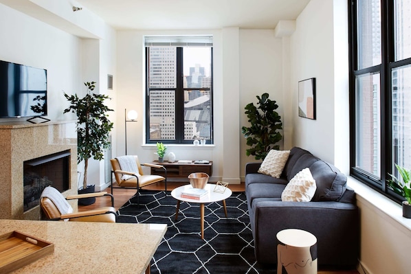 Spacious living room and kitchen filled with light throughout the day