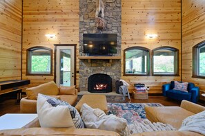 The heart of the main living area is the gas fireplace and smart tv.