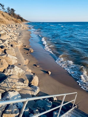 Lake Michigan Beach, accessed via shared deck/steps (photo taken April 2024)