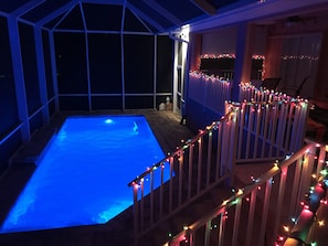 Pool at night, don't mind the Christmas lights!