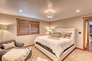 Upstairs Master BR w/KING temperpedic mattress, and a louge chair for reading. 