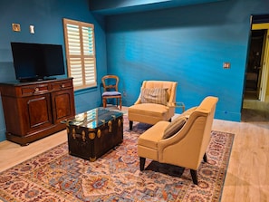 Master bedroom seating area with TV