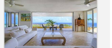 Living room with 18' disappearing door wall.  Ocean views from 3 sides.