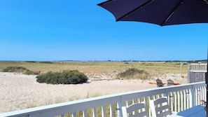 You may never leave the deck with gas grill, dining table and loungers