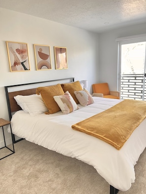 Master bedroom with King size bed, desk work area located in this room as well.