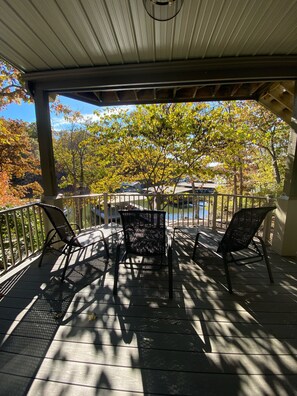 Covered lower deck with lake view. 