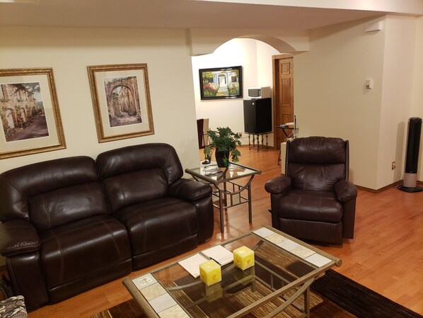 lovely plush reclining Love seat and Recliner.54" smart T.V. c/w NETFLIX MOVIES.