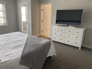 Master bedroom, bed, TV, bathroom and veranda. 