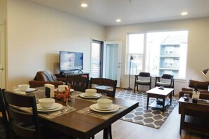 Dinning table and living room. 65 inch Samsung smart TV.