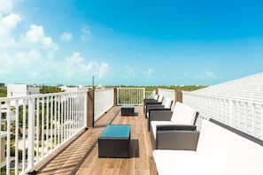 Communal roof deck with the ocean view of Long bay.