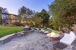 Peaceful garden and maintained backyard wrapped in a blanket of lush, green lawns.