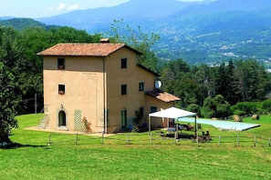 The house with the pool in front