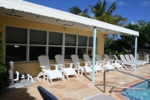 Lanai with Adirondack seating and ottomans