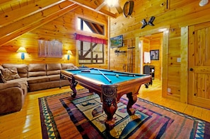 Play pool on our 8 foot pool table up in the game room.