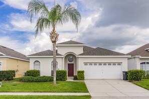 the front of house with converted garage .  A Windsor Palms one of a kind!