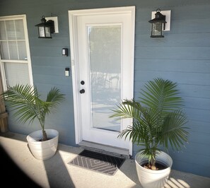 Front door. Lock Box on left side. You must enter the code to close the lock box