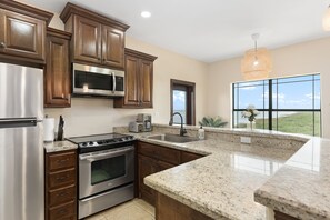 Kitchen with stainless steel appliances. 