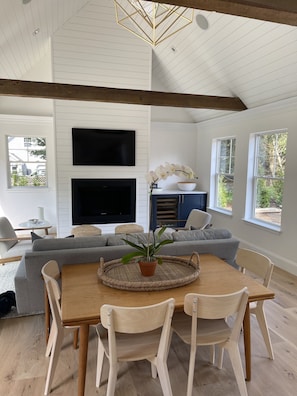 Dining room/living room  with fireplace, Frame TV and Wine Fridge. 