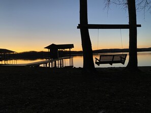 Enjoy incredible sunsets from the swing at the waters edge.