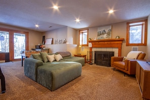 Cozy up with a fire while enjoying your favorite shows or while challenging your friends to a game of shuffleboard