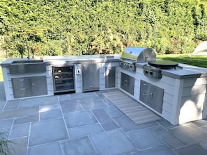 Luxury new outdoor Kitchen with wine & bev fridges, bbq, evo and burner 
